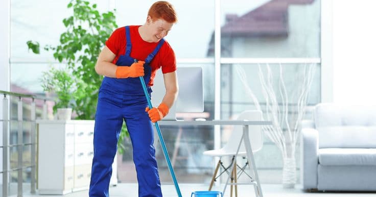 Scrubbing a surface covered in cleaning foam